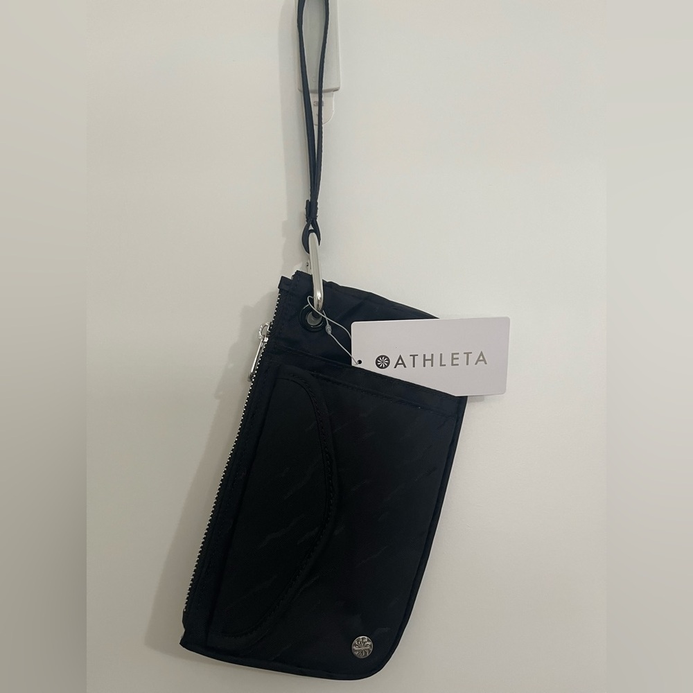 Athleta brand Coffee Run Clutch.
New with tag. Zipped clutch with handle.